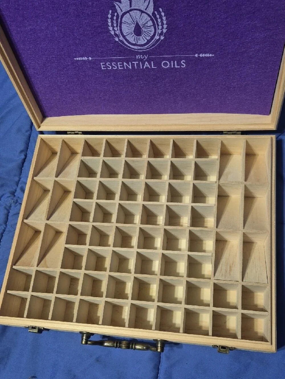 ​Wooden essential oils storage box with laser-engraved logo. Light natural wood